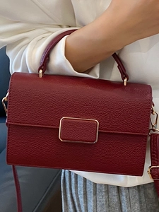 Elegant deep red leather crossbody square bag with gold hardware and top handle for women