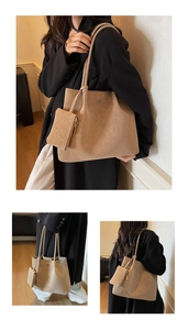 Detail view of large tote bag with sub-bag attachment and textured leather finish