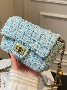 Chic tweed flap bag with gold chain strap and adjustable gold ball detail in light blue