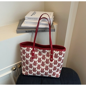 Detail of red festive double joy pattern on canvas tote bag with leather strap