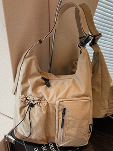 Khaki large capacity crossbody bag with multiple pockets and adjustable shoulder strap
