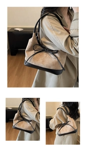 Vue détaillée du grand nœud noir sur le sac fourre-tout en daim beige et cuir