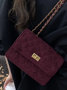 Burgundy quilted chain bag for women with gold ball lock and elegant velvet texture