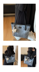 Detail of grey tote bag with bear embossing, metallic brand plate and plush pendant charm