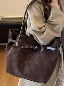 Fashionable dark brown suede tote bag with decorative buckle for casual commuting use