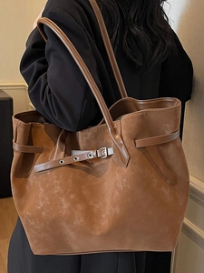 Large caramel suede tote bag with decorative buckle strap and double shoulder handles