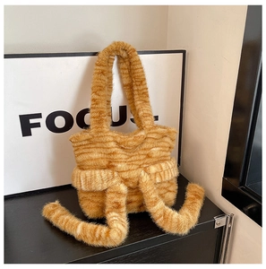 Detailed view of the tiger-striped plush tote bag with faux fur texture and long straps