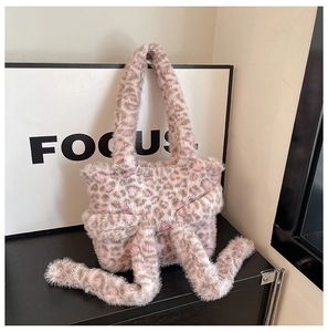 Close-up of pink and grey leopard print faux fur tote bag with a long decorative tail