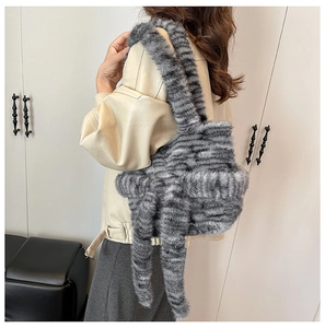 Detail shot of a soft faux fur tote bag with stylish grey and black tiger stripes