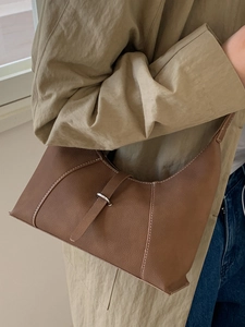 Chic caramel brown underarm bag with contrast stitching and silver buckle detail