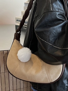 Retro khaki suede crescent underarm bag with plush ball charm and brown leather strap
