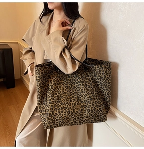 Chic leopard print canvas tote bag styled with a trench coat for a minimalist autumn look