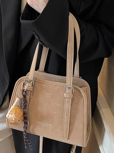 Chic beige shoulder bag in glossy vintage leather with metal buckles for women