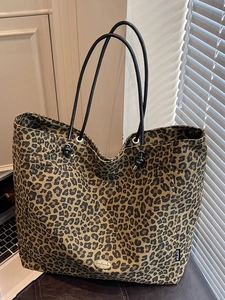Large leopard print tote bag with black handles and metal handmade tag for daily use