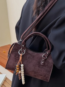 Vintage dark brown suede shoulder bag with silver studs and wooden bead charm accent