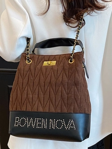 Brown quilted suede shoulder bag with gold chain strap and black leather trim accents