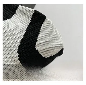 Close-up of premium black and white striped knit texture and high-quality woven fabric detail