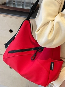 Vibrant red large capacity nylon tote bag with black wide strap for daily commute