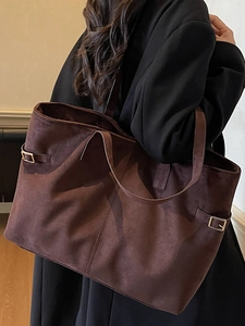 Minimalist large brown suede tote bag for women showing spacious interior and metal buckle detail