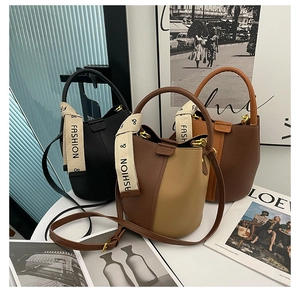 Three bucket bags in black and brown pebble leather with woven straps and gold hardware