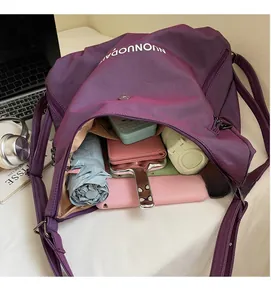 Top view of large purple nylon tote bag showing spacious interior with multiple compartments