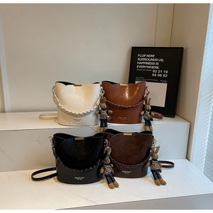 Detail showing high-quality PU leather bucket bags in four colors with woven handles