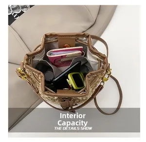 Detail of plush bucket bag internal capacity showing storage for phone and wallet
