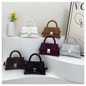 Chic trapezoid handbags in snake texture colors including silver and burgundy tones