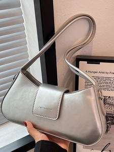 Chic silver minimalist underarm shoulder bag with metallic texture and foldover flap cover