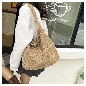 Close-up of brown plush tote bag made of fleece material showing soft fuzzy texture
