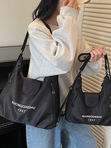 Black lightweight nylon tote bag set in large and small sizes with adjustable straps
