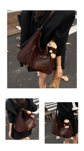 Detail of dark brown suede tote bag with ZSKE PARIS logo pocket and cute plush bear charm