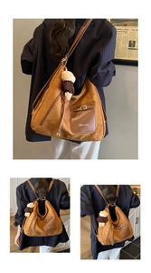 Detail of caramel suede texture with brand logo and plush bear charm on shoulder bag
