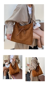 Détail du grand sac cabas en daim marron caramel avec nœud décoratif élégant