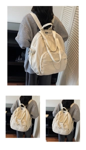 Detailed view of off-white large capacity canvas backpack with multi-pocket design for travel