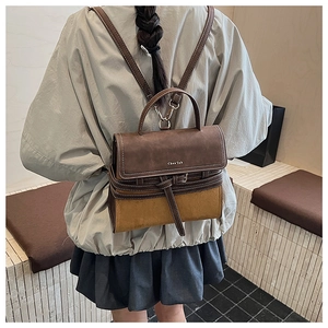 Detail view of British style retro backpack with color-blocking frosted leather and handle