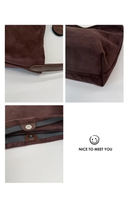 Detail of dark brown suede bag with magnetic closure, zipper, and precise stitching