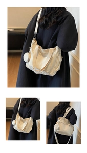 Detail view of canvas tote bag with adjustable shoulder strap and round mini pouch