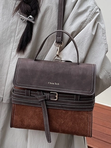 Retro vintage color-block handbag in coffee brown leather with crossbody strap and silver buckle
