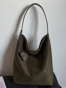 Large olive green suede hobo bag for women featuring a minimalist tote design for work