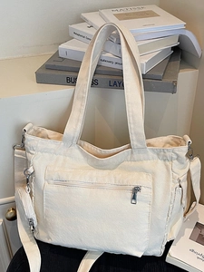 Sac fourre-tout minimaliste en toile crème avec poche zippée et bandoulière