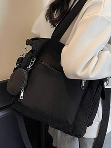 Grand sac cabas noir minimaliste en toile avec pochette et large bandoulière