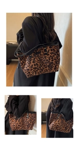 Detail view of leopard print tote bag featuring black handle accents and metal rivets