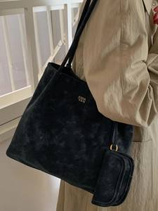 Minimalist black suede tote bag with golden logo and matching pouch for women