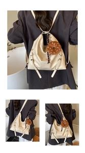 Detail view of a beige faux leather hobo backpack with stylish donut plush charm decoration