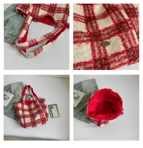 Detail view of red and white striped plush tote bag with handmade metal tag and red lining
