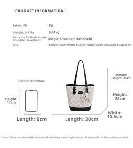 Detailed view of the large checkered tote bag with size dimensions and plush charm accessory
