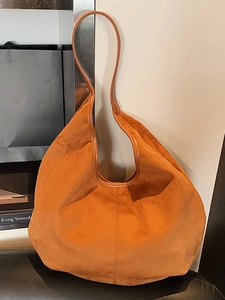 Large caramel suede tote bag with minimalist center stitching for casual commute style