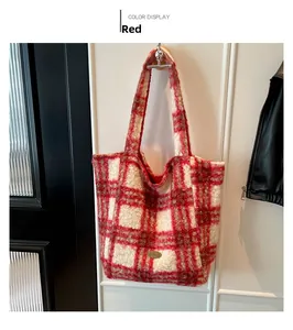 Close-up of red and white striped plush tote bag featuring a handmade metal logo tag