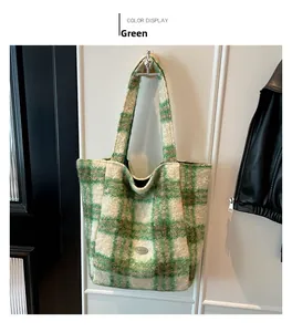 Detail of green and white striped plush tote bag with oval metal logo and fuzzy texture